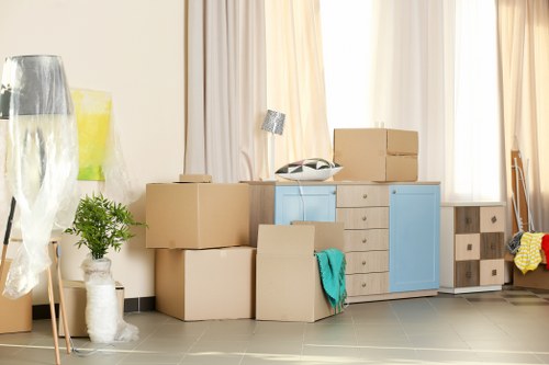 Professional packers organizing boxes in a storage unit