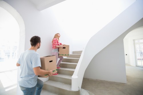 Office furniture being carefully moved into storage