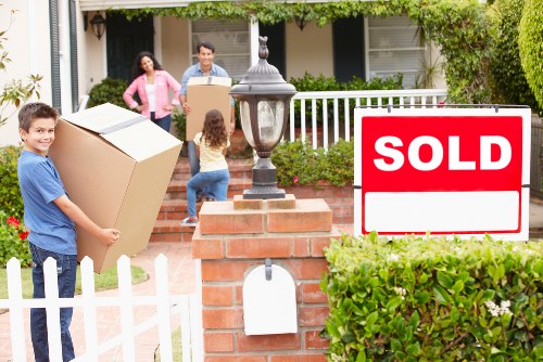 Professional movers loading items into a removal truck